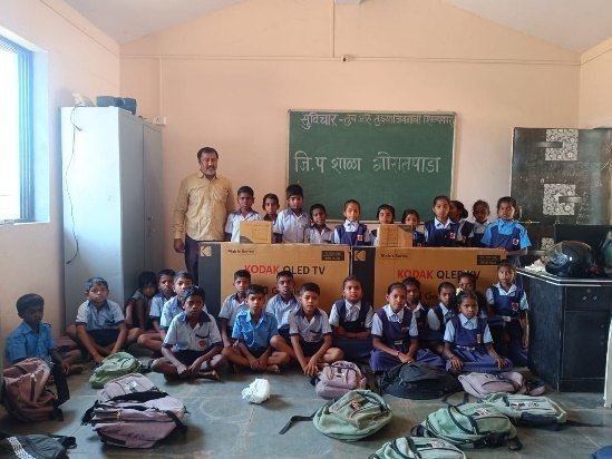 Students of Goratpada Z. P. School with their new smart TVs