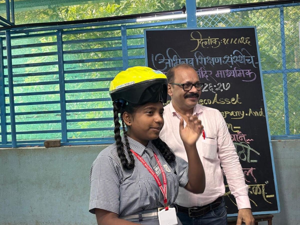 A student receives her bicycle and helmet