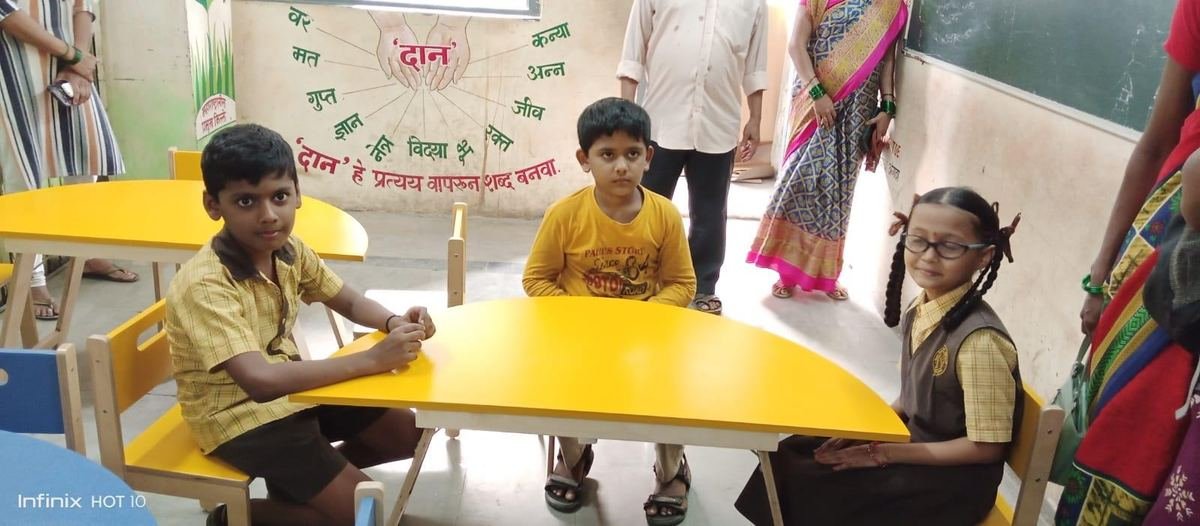 Children at their new tables in the pre-primary section