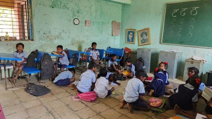 Students in a classroom before the renovation