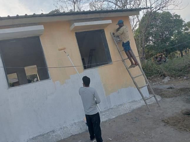 Painting the outside of the school