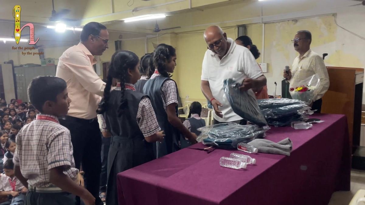 Handing out the school bags