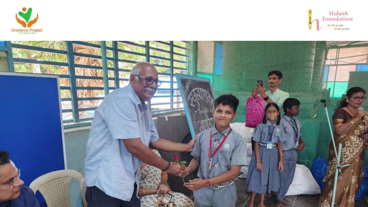 A student receives his uniform