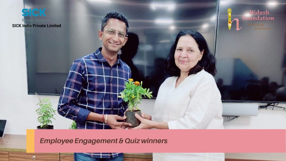 A quiz winner receives a plant