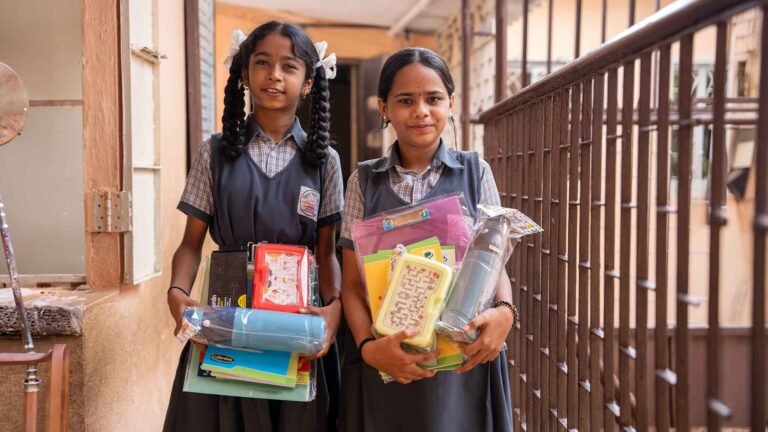 Students of Vidarbha Vidya Mandir receiving school supplies from Hidush Foundation in Kurar Village, Malad East, Mumbai